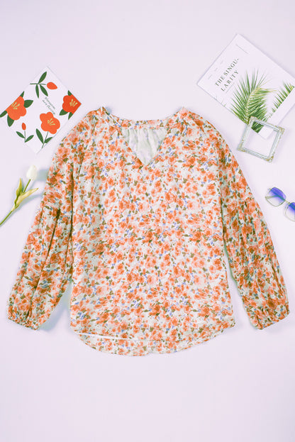 Blusa con cuello en V y mangas largas abullonadas con estampado floral multicolor