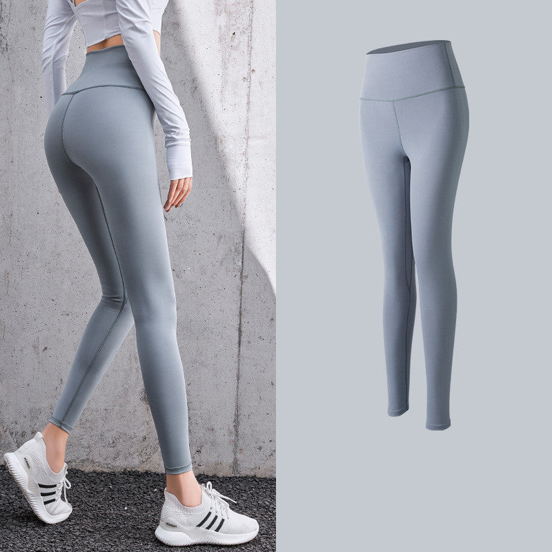 Enge, pfirsichfarbene Hüft-Leggings mit hoher Taille und Fitnesshose