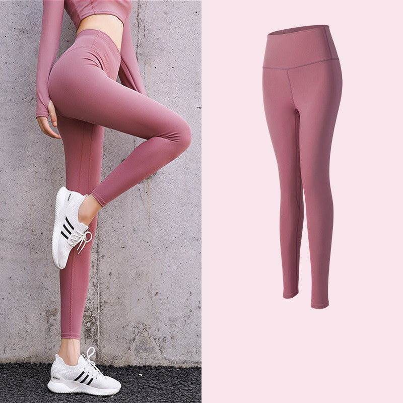 Enge, pfirsichfarbene Hüft-Leggings mit hoher Taille und Fitnesshose