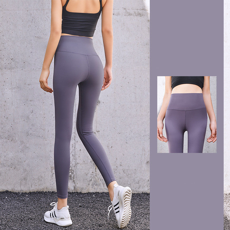 Enge, pfirsichfarbene Hüft-Leggings mit hoher Taille und Fitnesshose