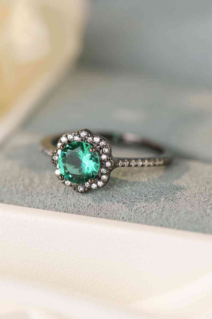 Anillo con forma de flor de circonitas azules de Paraiba