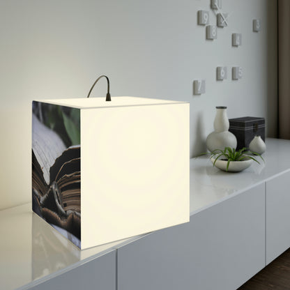 Unbeknownst to its readers, the book possesses magical powers.

"The Forgotten Tome of Magic" - The Alien Light Cube Lamp