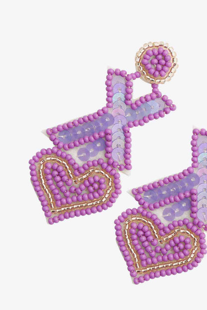 2 pares aleatorios de aretes colgantes con cuentas en forma de X y corazón