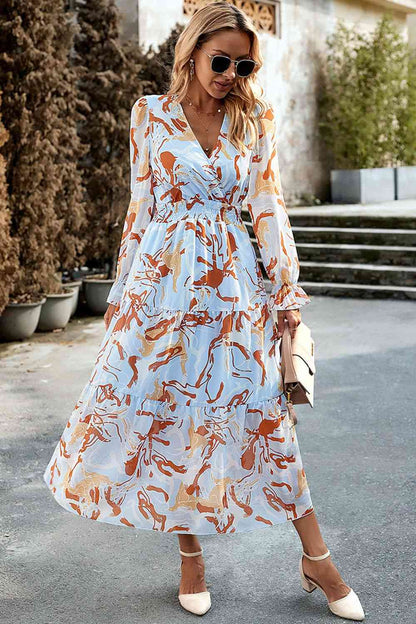 Vestido midi estampado con cuello superpelliz y mangas con volantes