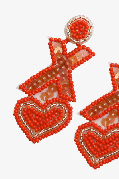 2 pares aleatorios de aretes colgantes con cuentas en forma de X y corazón