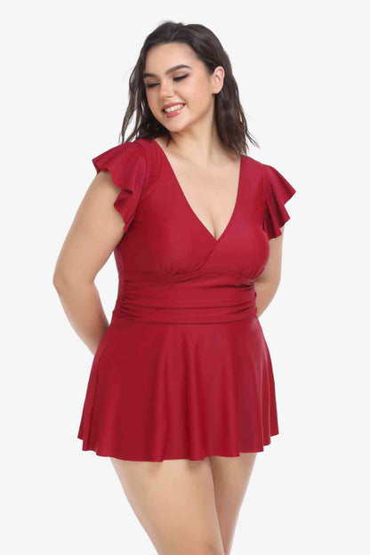 Plus-Size-Set aus gerüschtem Badekleid und Badehose mit tiefem Ausschnitt